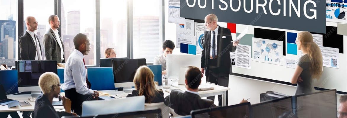 Business professionals reviewing outsourcing plans